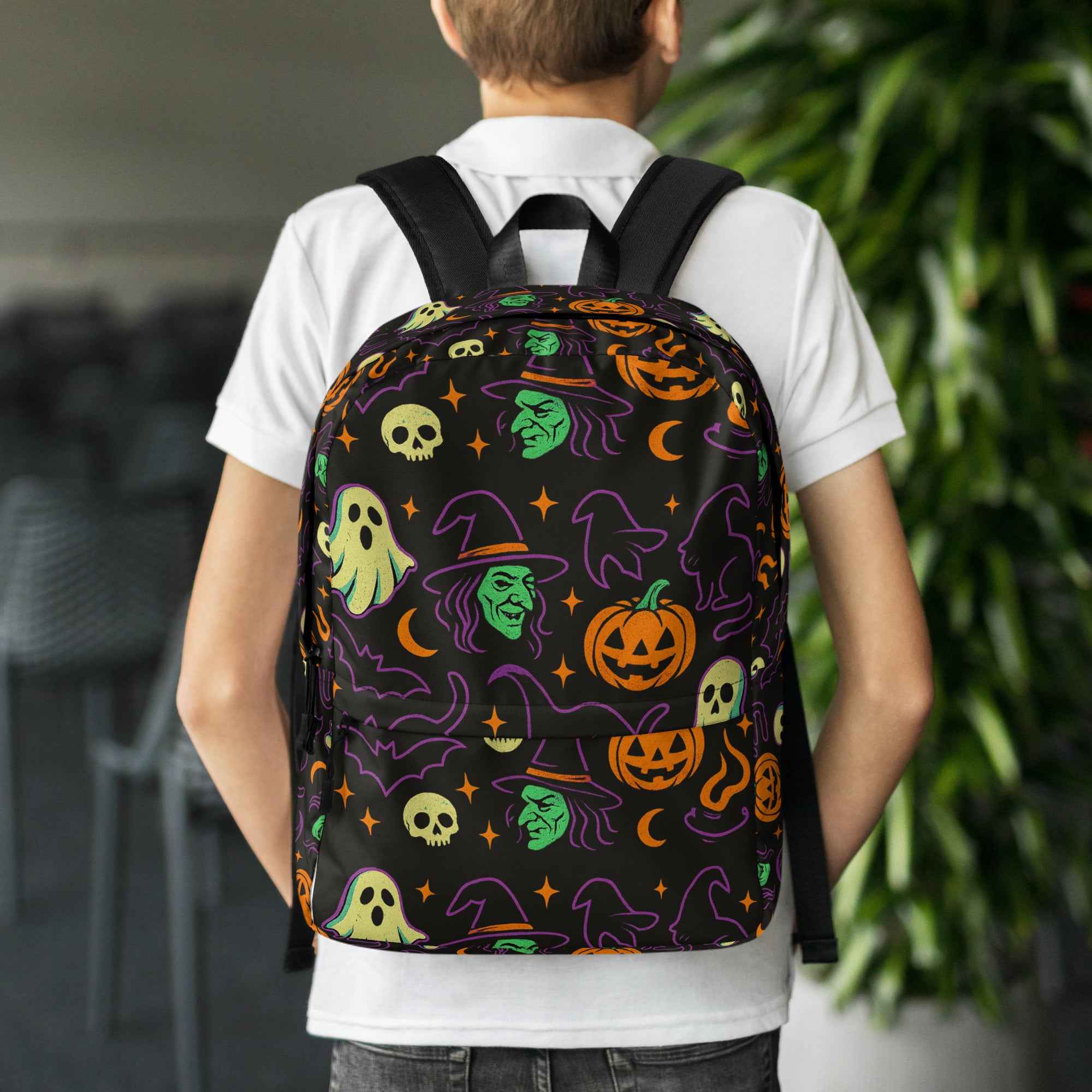 Model wearing a stylish and spooky backpack from Rare Plus Apparel, part of the Bags Collection featuring totes, backpacks, and napsacks.unique and stylish designs.