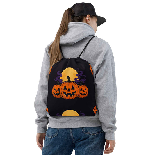 “Midnight Pumpkins” The Jack-O-Lantern Parade Drawstring bag