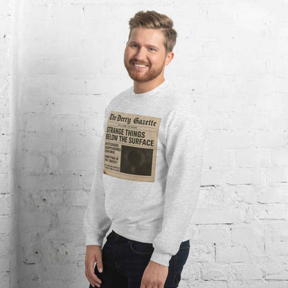 The Derry Gazette “Strange Things Below the Surface” Unisex Sweatshirt