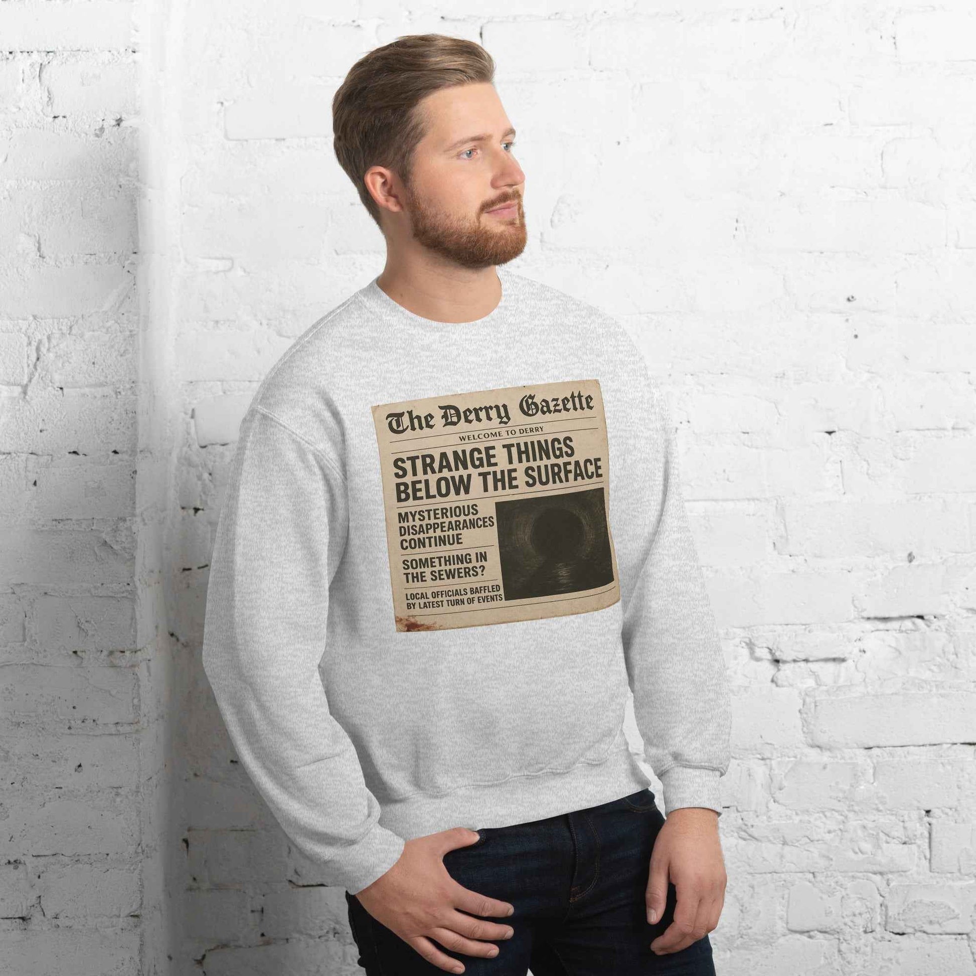 The Derry Gazette “Strange Things Below the Surface” Unisex Sweatshirt