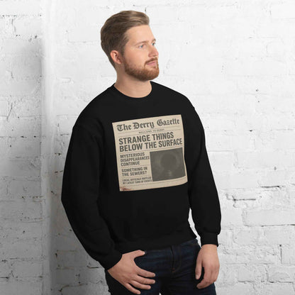 The Derry Gazette “Strange Things Below the Surface” Unisex Sweatshirt