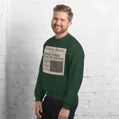 The Derry Gazette “Strange Things Below the Surface” Unisex Sweatshirt
