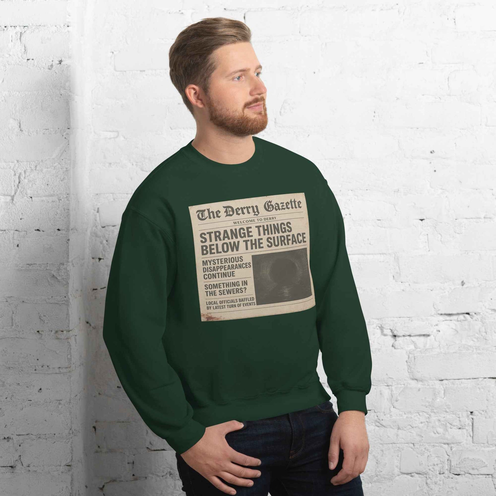 The Derry Gazette “Strange Things Below the Surface” Unisex Sweatshirt
