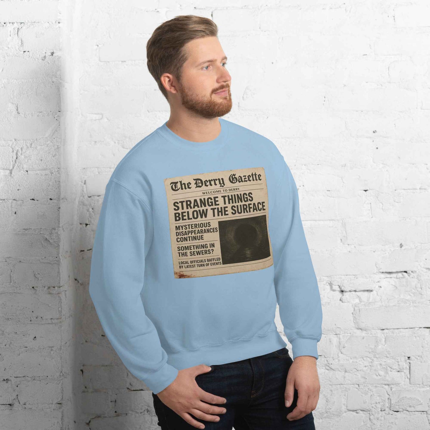The Derry Gazette “Strange Things Below the Surface” Unisex Sweatshirt
