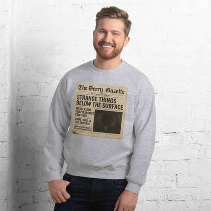 The Derry Gazette “Strange Things Below the Surface” Unisex Sweatshirt
