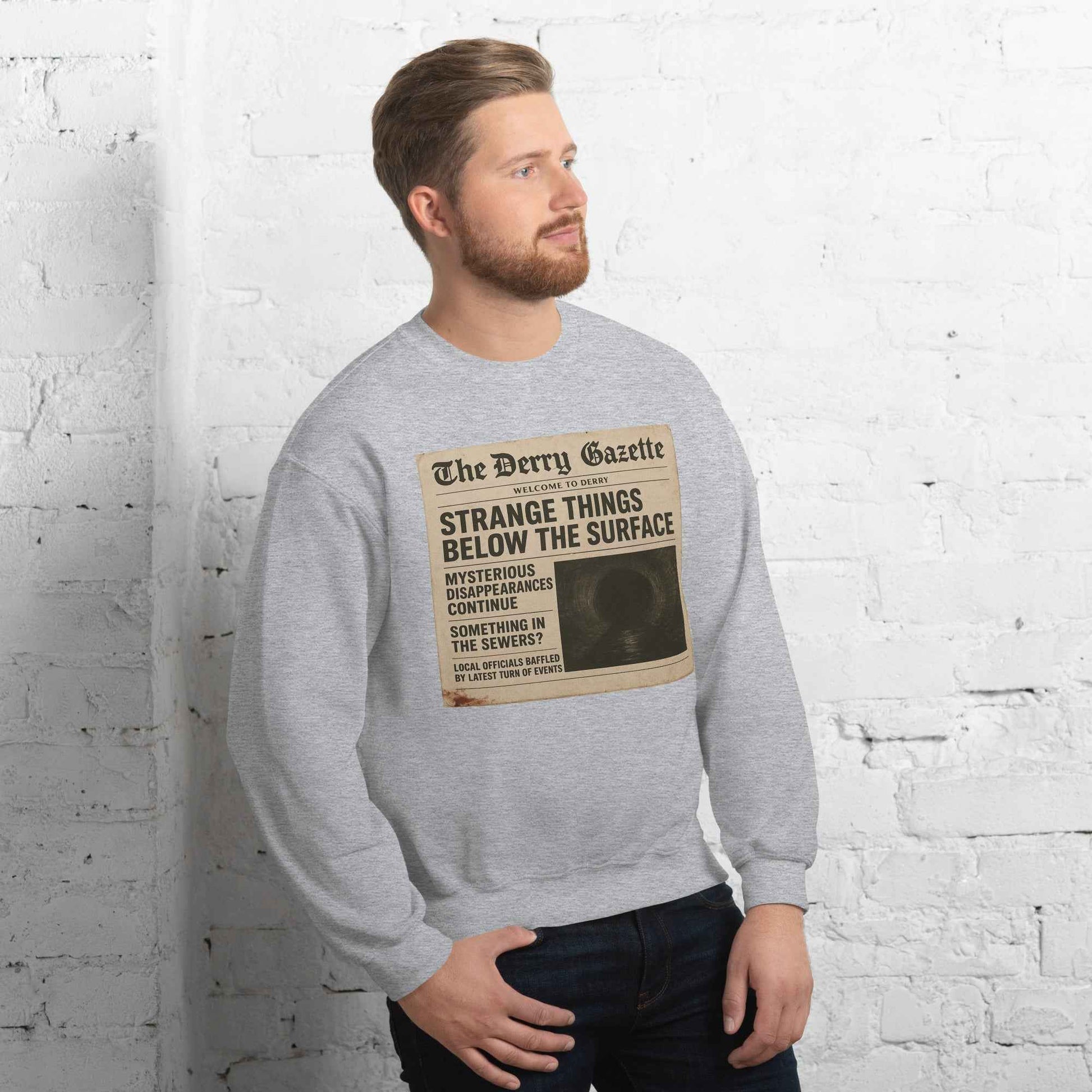 The Derry Gazette “Strange Things Below the Surface” Unisex Sweatshirt