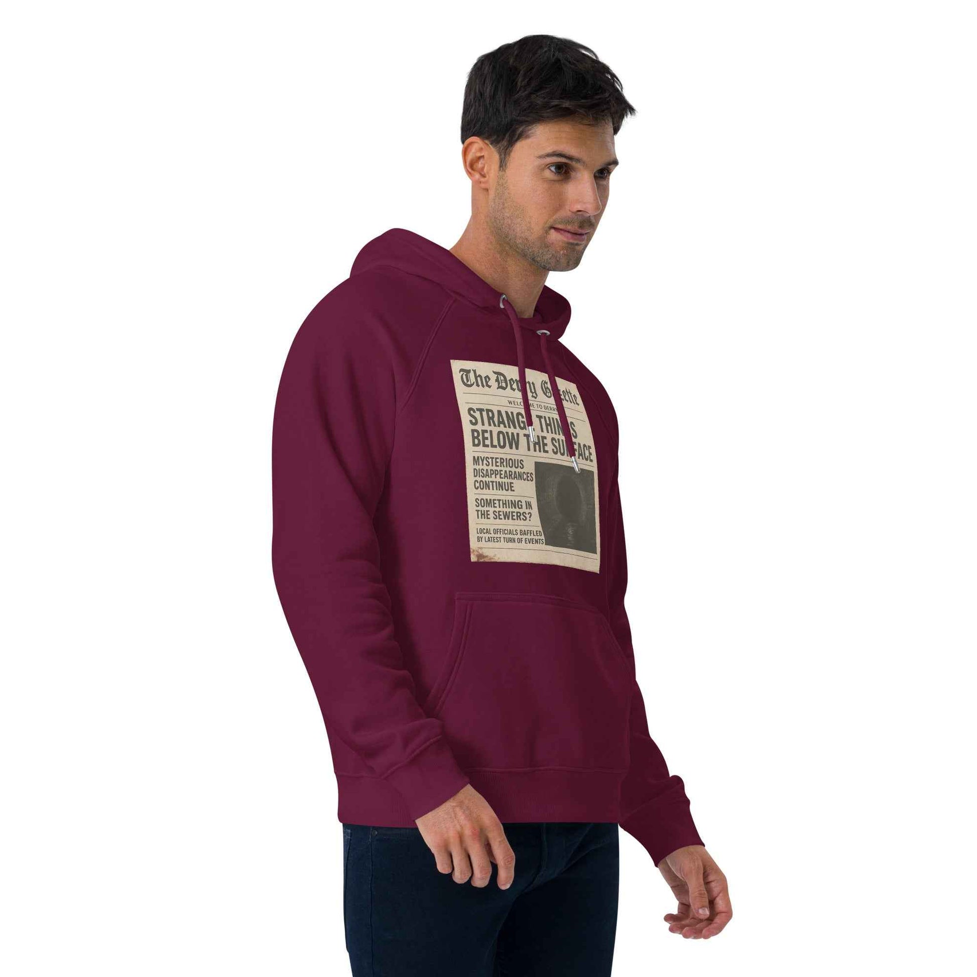 The Derry Gazette “Strange Things Below the Surface” Unisex eco raglan hoodie